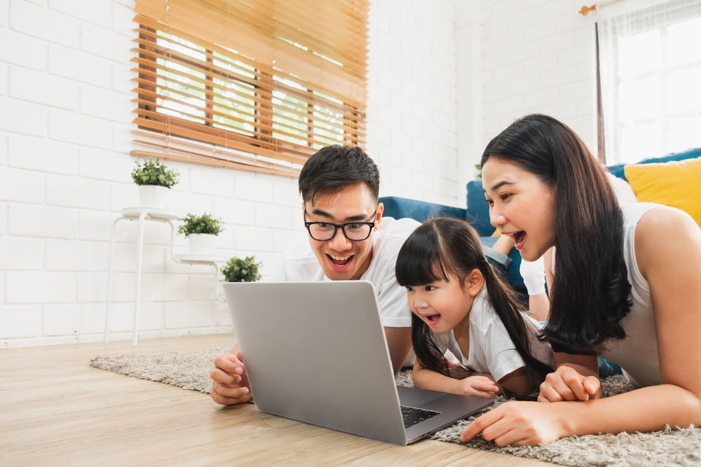 family using laptop (virtual tour)